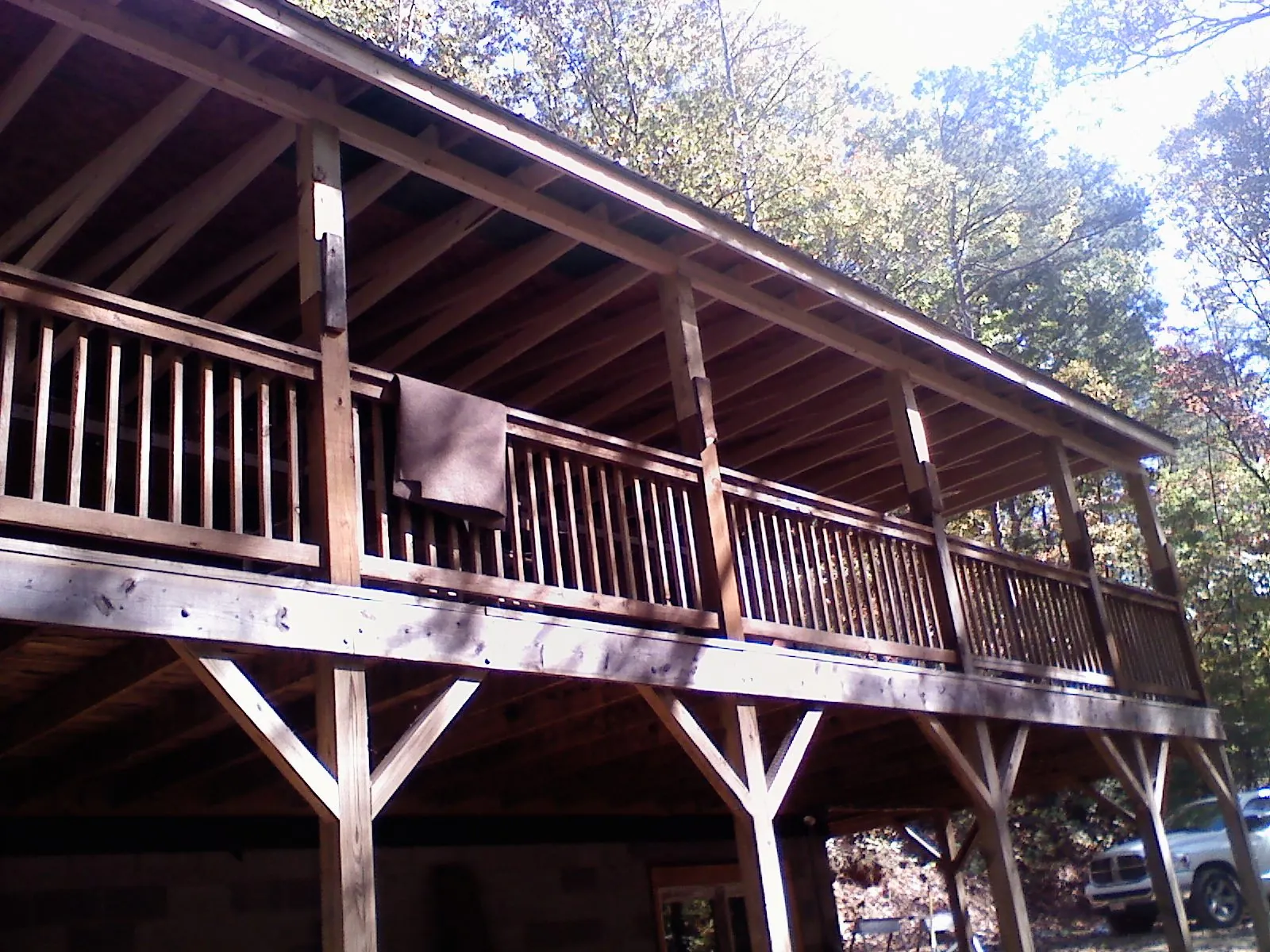Timber framing under a new elevated porch and deck — Roof Leak Repair in Darien Center by Roofing Brothers